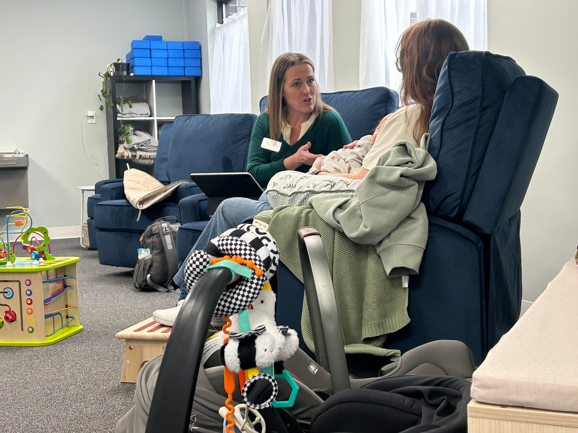 Two mothers in conversation during peer support